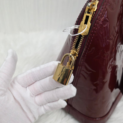 Louis Vuitton Patent Alma Handbag (Pre-owned)