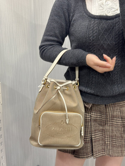 Prada Canvas Drawstring Bucket Bag with Front Logo Pocket (Pre-Owned)