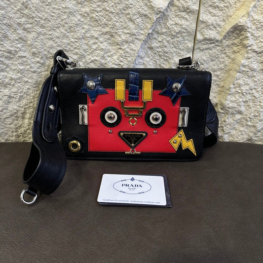 Prada Robot Appliqué Flap Shoulder Bag in Black Leather with Multicolor Patches (Pre-owned)