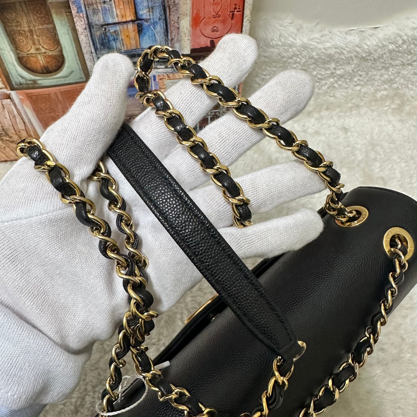 Chanel Black and Gold Flap Bag [pre-owned]